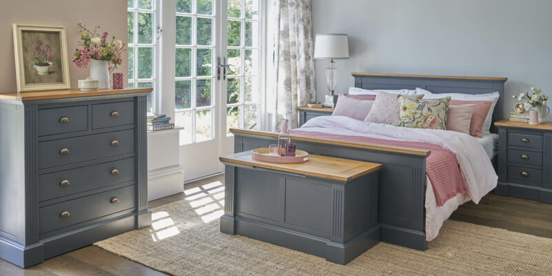 Dark blue Highgate bedroom furniture in a light-filled room.
