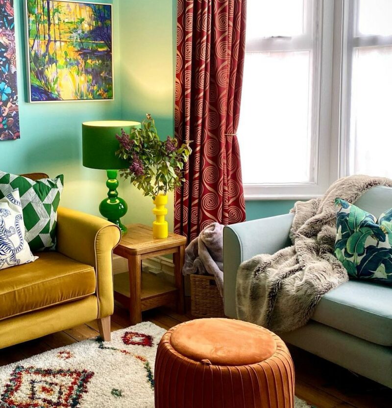 Colourful maximalist livin room with Orrick rustic oak nest of tables.
