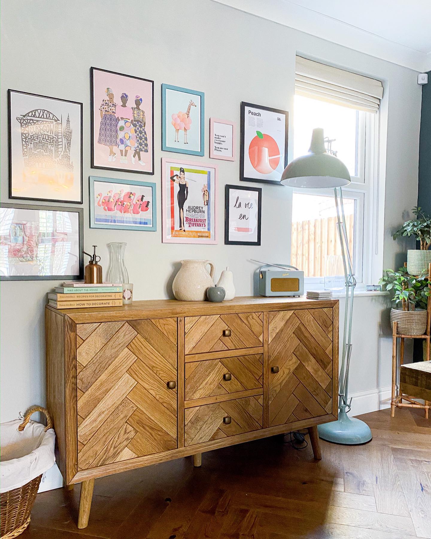 Oak Furnitureland Parquet sideboard with a colourful gallery wall above.
