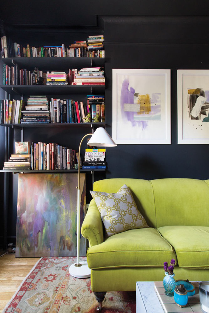 greenery sofa on dark walls with library