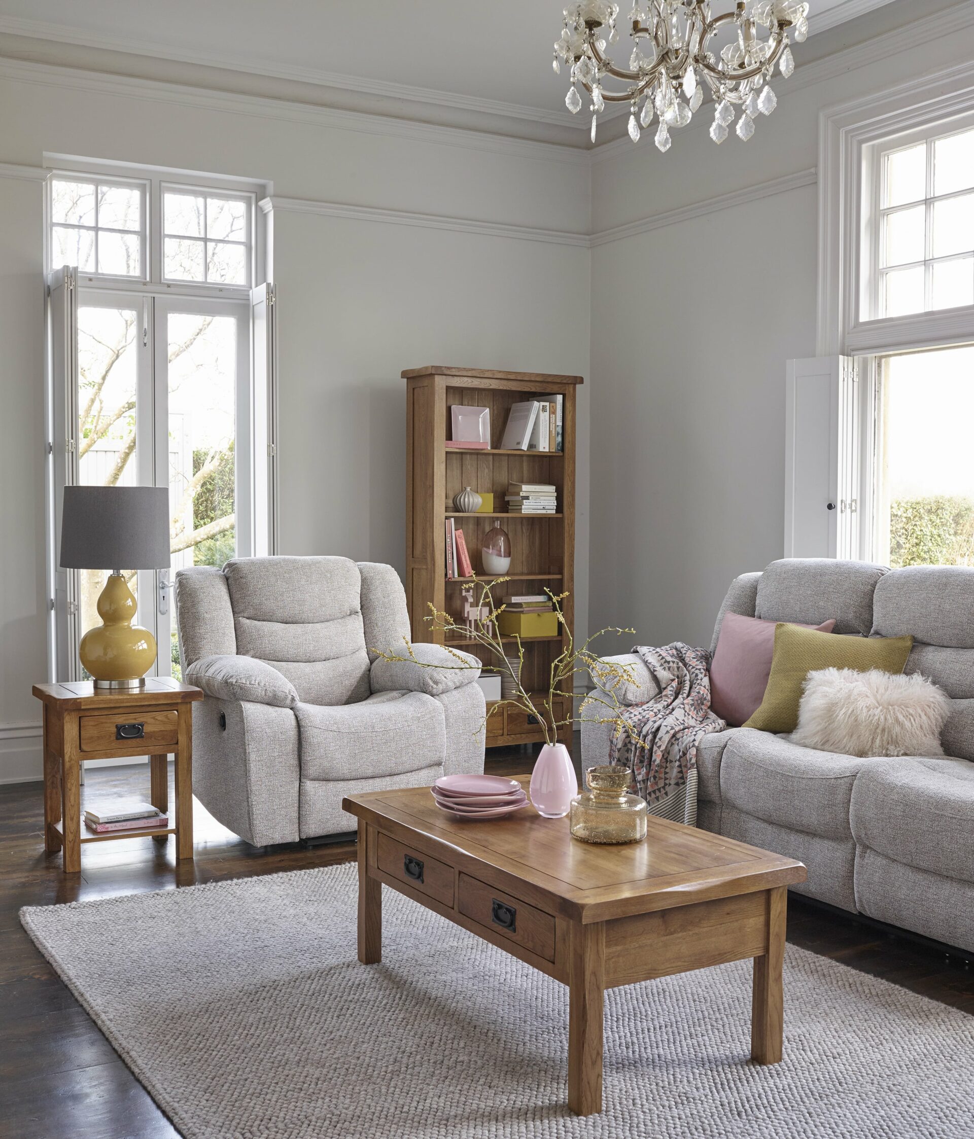 Grey recliner sofa and armchair paired with Original Rustic coffee table, side table and bookcase.