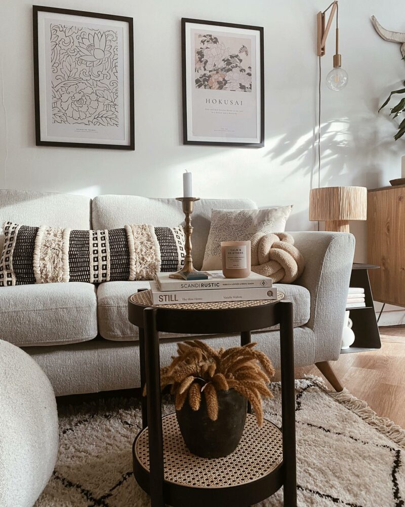 Oak Furnitureland Bridgeport cream sofa styled with textured cushions in a living room with neutral details and styling.