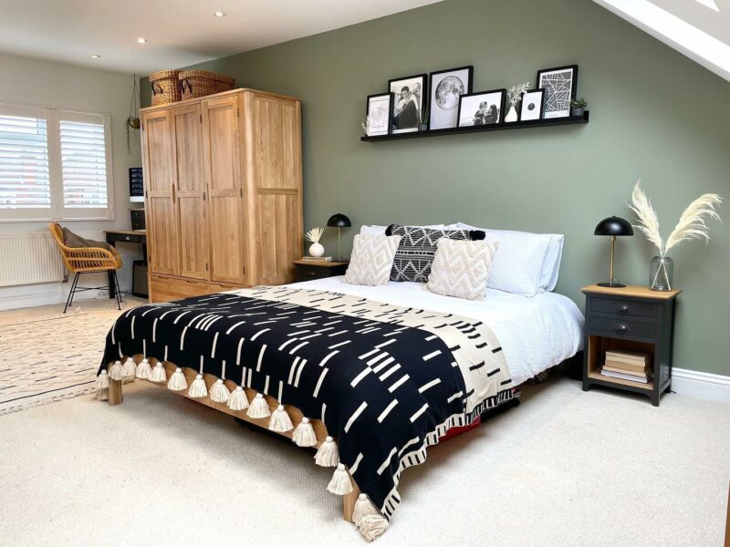Sage green bedroom featuring the Oak Furnitureland Romsey wardrobe.