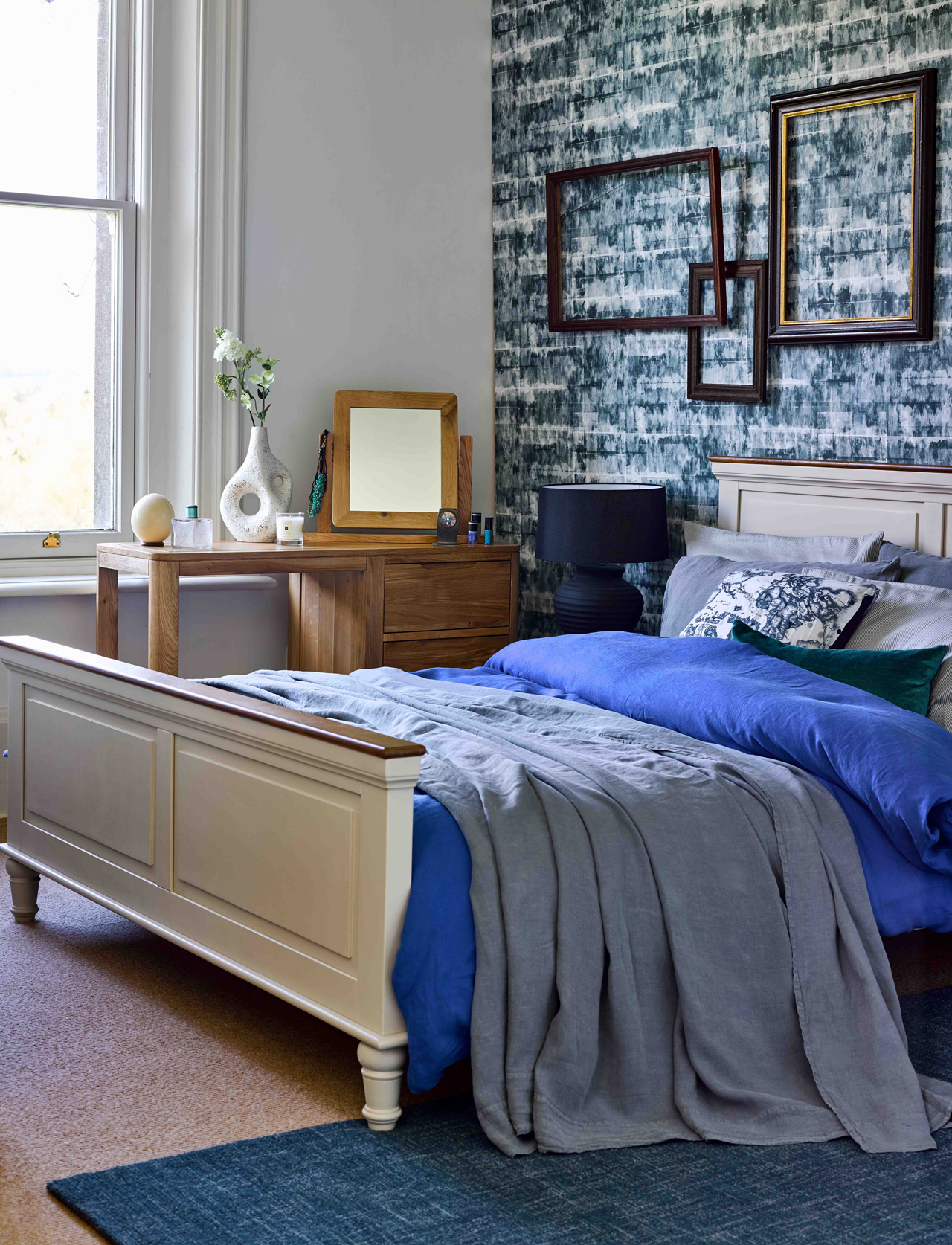statement wallpaper and blue grey bedroom decor
