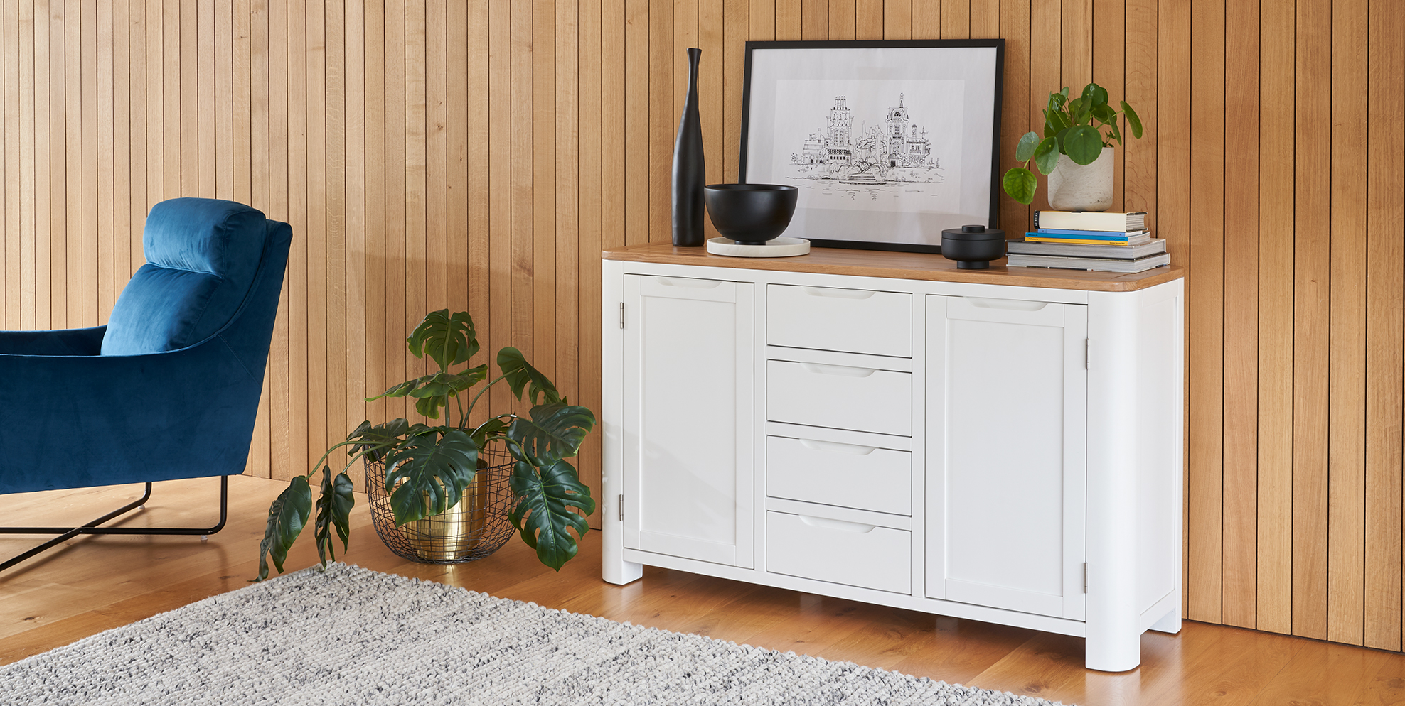White painted furniture and blue velvet chair
