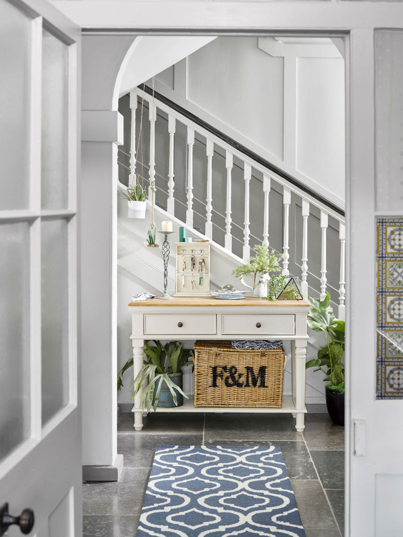 White oak console table in bright hallway
