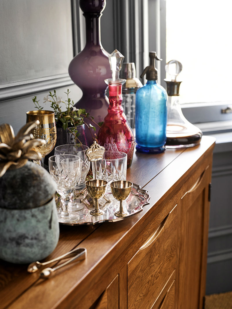 Rustic oak sideboard serving drinks