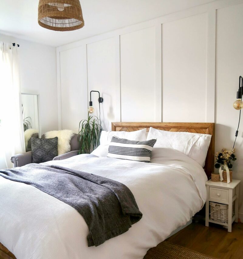 Peaceful white bedroom with Oak Furnitureland Parquet bed and rattan accessories.