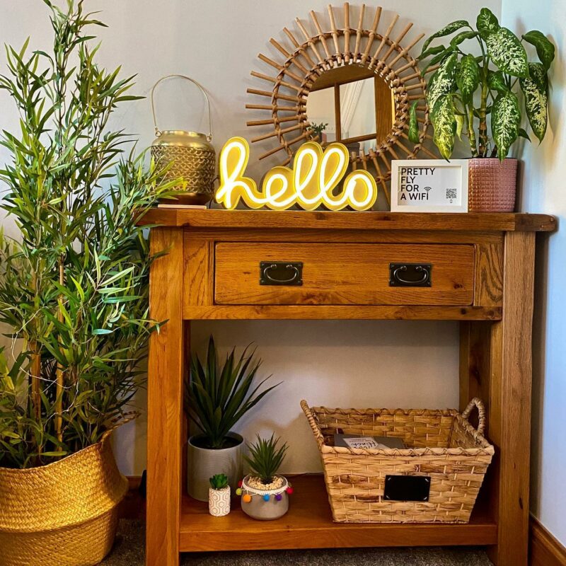Oak console table with lots of plants