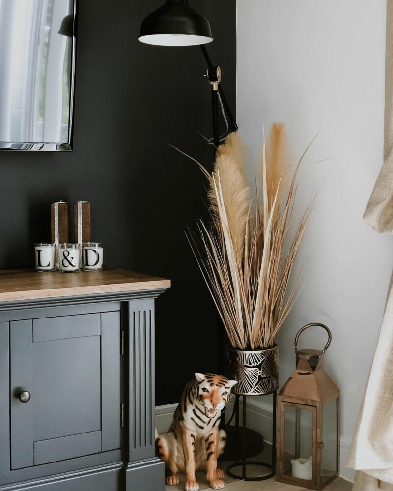 pampas grass decor with dark blue painted oak tv unit