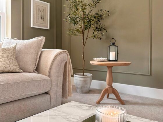 Cream Oak Furnitureland Ashby sofa in an olive green living room with neutral accents.