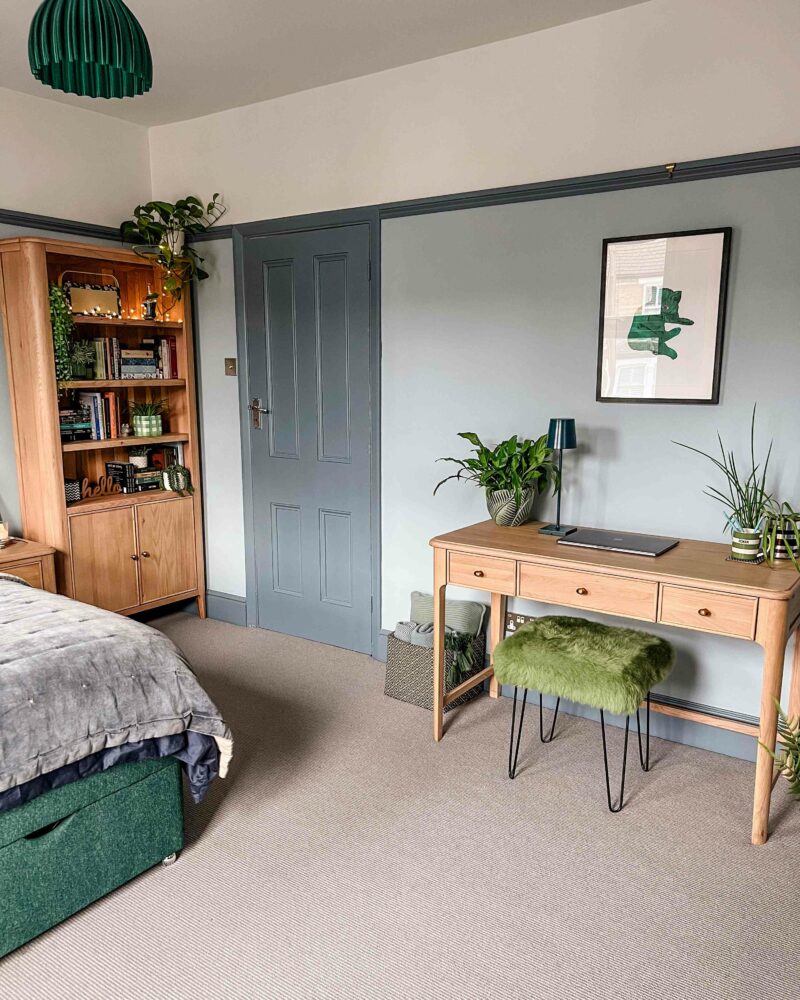A desk and bookcase-bedroom furniture-wooden desk-wooden bookcase-houseplants-painted door