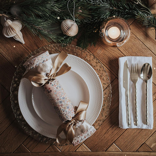 Parquet dining table styled for Christmas with a reusable fabric cracker.