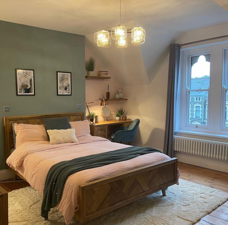 A bed and dressing table-bedroom furniture-wooden double bed-wooden dressing table with drawers-upholstered chair, green wall colour