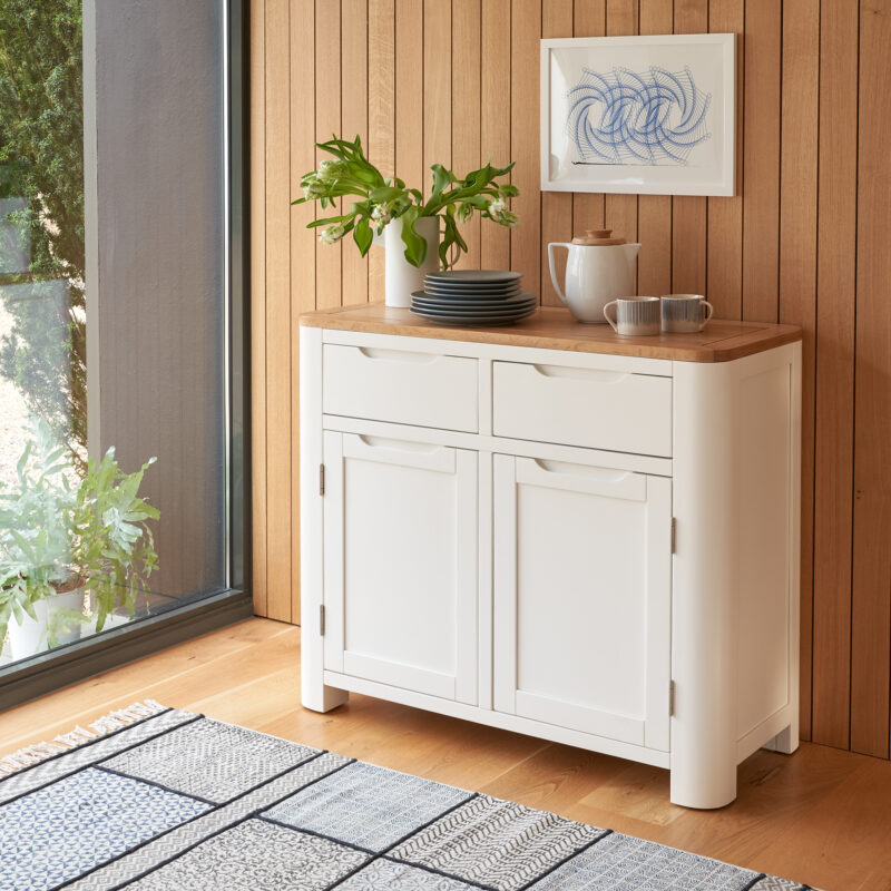 A sideboard-kitchen furniture-cream sideboard-flowers-crockery